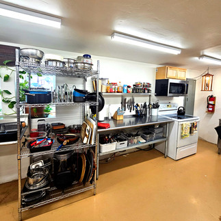 Fully stocked communal guest kitchen with appliances and cookware at Lee's Ferry Lodge near Vermilion Cliffs.