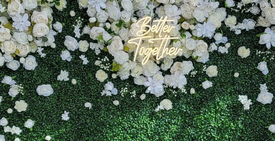 Better Together: White roses and greenery wall