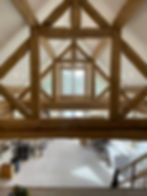 Interior with exposed timber frame and white walls