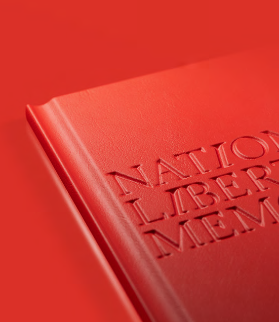 Red book cover with embossed National Liberty Memorial text.
