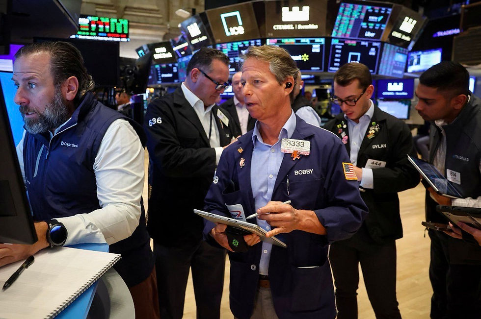 Traders and specialists actively engage on the bustling floor of the New York Stock Exchange, closely monitoring market trends and executing transactions.