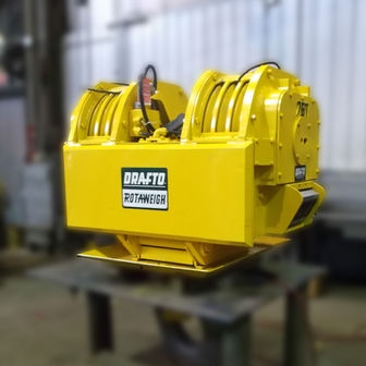 Bright yellow DRAFTO ROTAWEIGH industrial machine for heavy lifting.