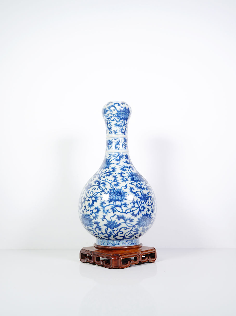 Thumbnail: A Blue and White 'Lotus' Garlic-Head Vase with a Wooden Stand