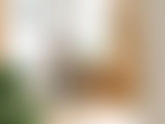 A man at a desk with earphones listening to a course