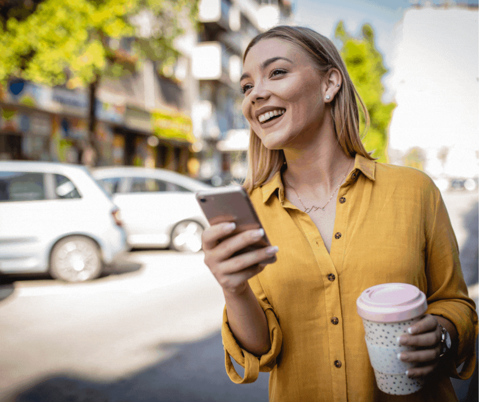 A woman on her phone waiting for a ride