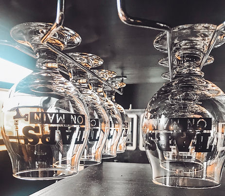 Customers choose a glass to use with our self-serving beer wall