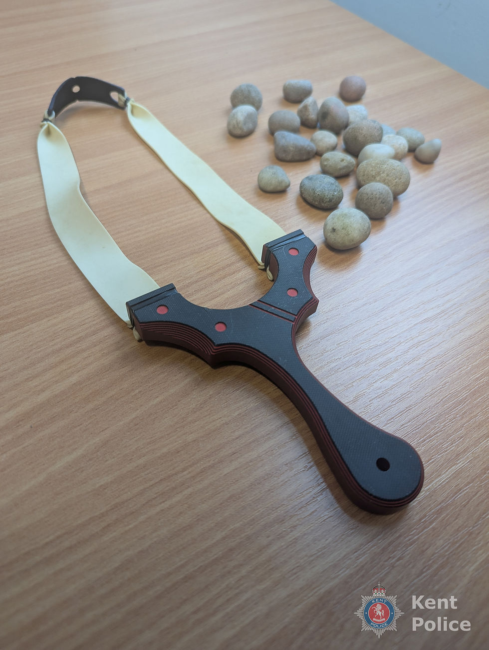 A catapult and stones confiscated by Kent police