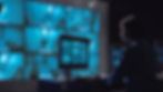 Single female security person monitoring closed circuit surveillance from multiple cameras