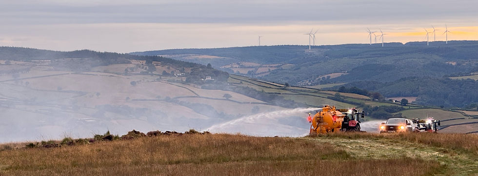 Local farmers watering fire breaks on Mynydd Cynros on Sunday night