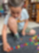 Boy making the word 'springboard' out of colourful letters.png