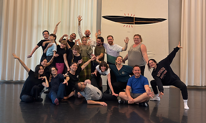Theatre practitioners in groups of three exploring spatial awareness and physical improvisation techniques at professional Berlin workshop