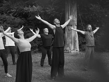 An international group of students at Laubegg Castle during the International  Physical Theatre Laboratory do tai chi in the morning with Sergei Ostrenko.