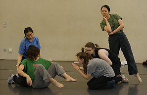 Theatre professionals practicing partner dynamics and physical contact exercises in NIPAI psychophysical acting workshop Berlin