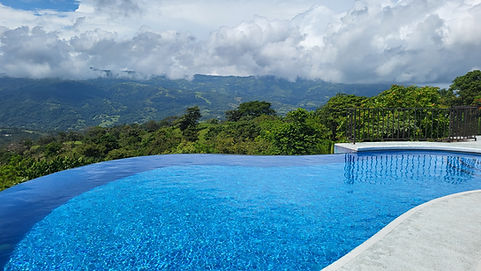 Home for sale in gated community in Atenas Costa Rica with pools views above the central valley.