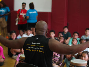 Drum instructor teaching a class