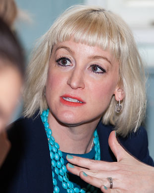 Kirsten Goodwin (Career Coach, expert in Career Coaching) holding a workshop with a blue jacket and turquoise necklace
