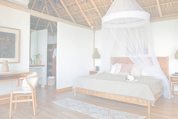 Ocean resort room with canopy bed