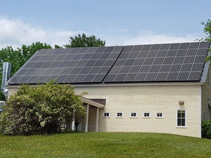 Cormack Construction's office and wood shop with solar energy panels in Madison NH