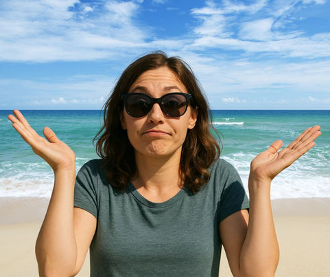 woman with dark sunglasses raises her hands to gesture that she isn't certain of the answer to "is your heating system ready for fall?"