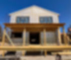 A house under construction with exposed wood framing and GPS (graphite polystyrene) foam board insulation.