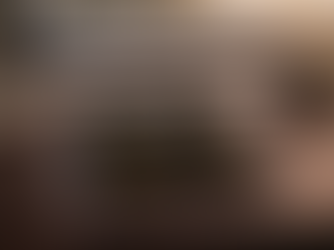 A Liquid Fuels Handling Guide designed for marine, rail, transportation, and heating oil rests on a desk with a view of a group of white commercial fleet trucks.