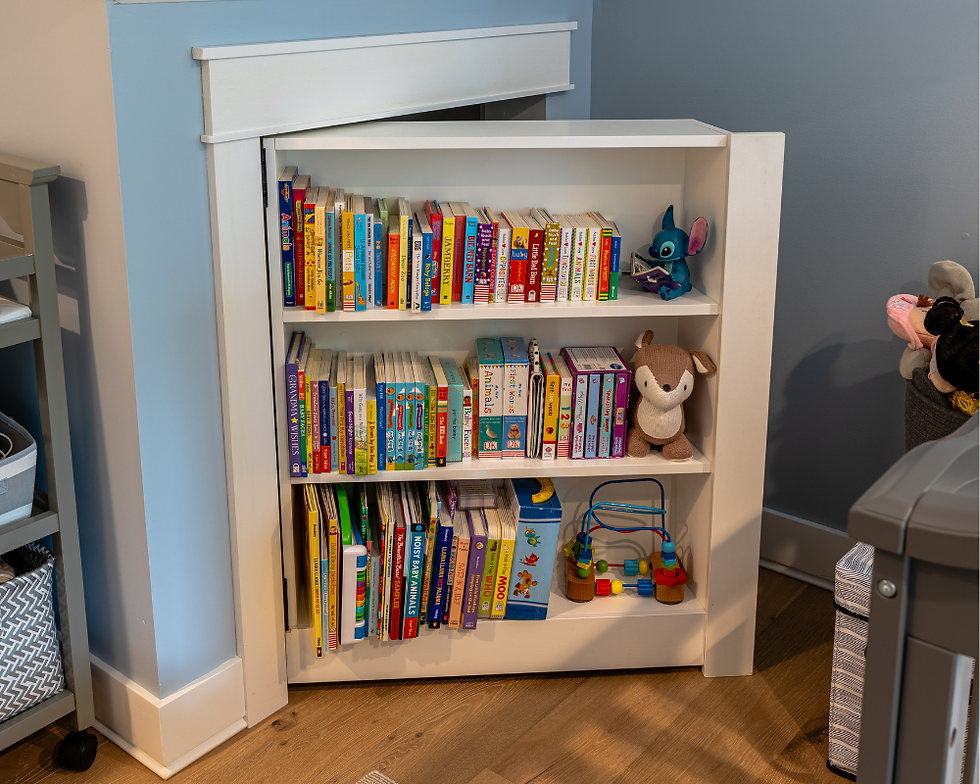 A small white bookcase is integrated into a door leading to a storage crawlspace, seamlessly blending thoughtful design with functionality.
