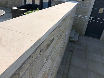 Stone wall with coping