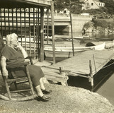 091 Nellie in Rockin Chair next to pier with boats 1200 dpi JPEG.jpeg