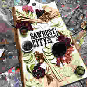 Live Edge Charcuterie board with custom Sawdust City logo by Live Edge Forest