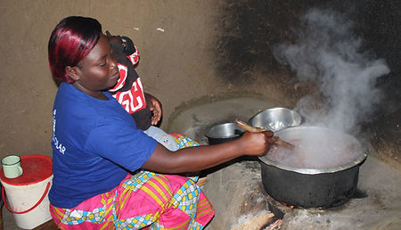 Ann Shivogo Ivakale village, Kakamega - cooking with upesi cookstove.jpg