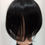 Thumbnail: Black wig on mannequin Simmy's Wigs; detailed view, hairpiece, natural appearance.