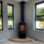 Westfire Uniq 45, 5kW, wood-burning stove on an Ancaster Hard White limestone hearth