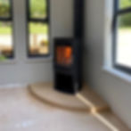 Westfire Uniq 45, 5kW, wood-burning stove on an Ancaster Hard White limestone hearth