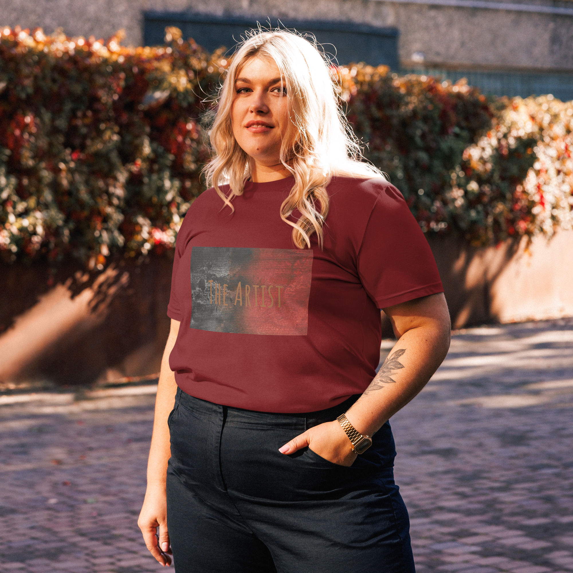 black and burgundy unisex t-shirt with abstract art print in back and maroon colors with printed words The Artist