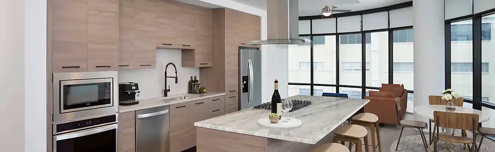 4-camden-downtown-apartments-houston-tx-warm-modern-finishes-in-kitchen-with-gas-range-qua