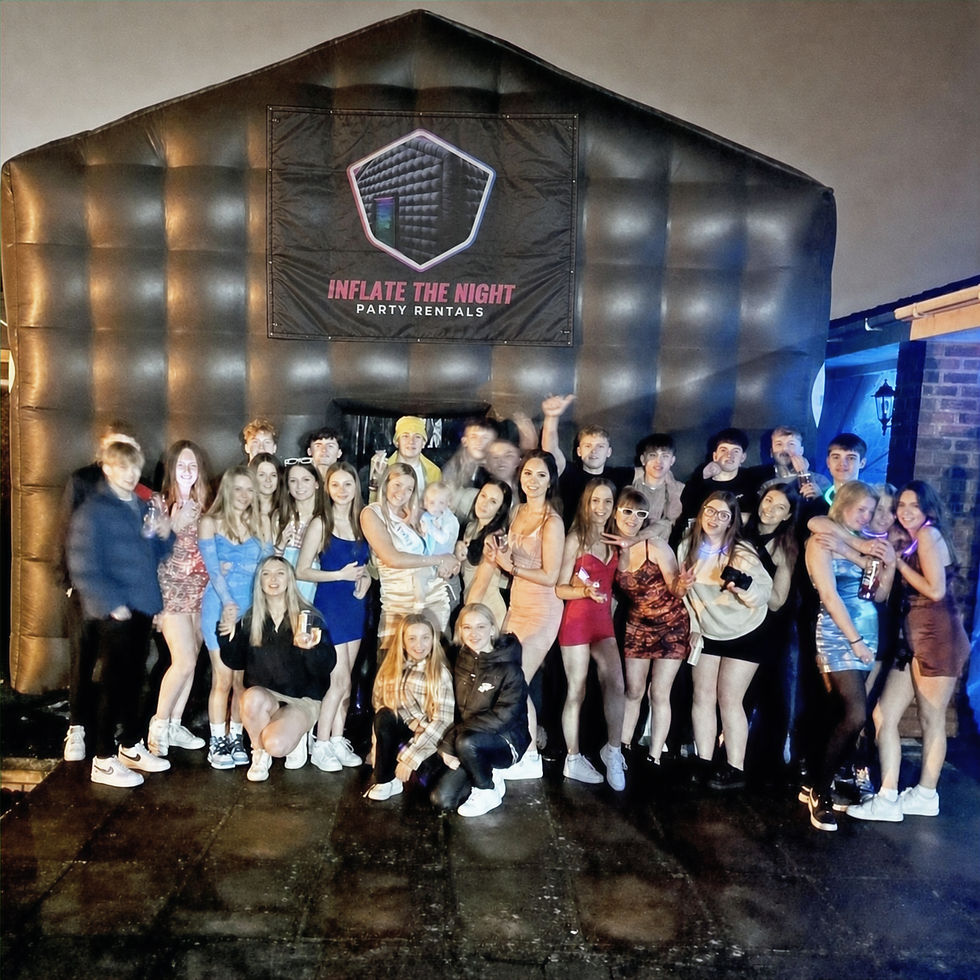 Party guests gathered at inflatable nightclub rental with fog and lighting effects in Charlotte NC