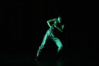 Pierre-Marc Ouellette 2020, dancer in green light leaning in a lunge.jpeg
