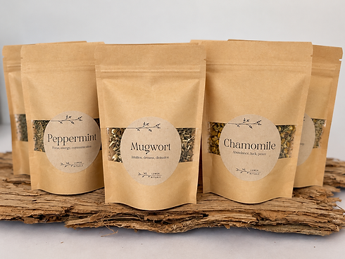 Ritual Herb Pouches on Rustic Bark.png