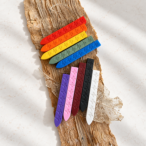 Rainbow Wax Sticks on Textured Bark.png