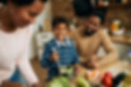 happy-black-boy-preparing-healthy-food-with-his-parents-kitchen.jpg
