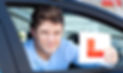 positvie-young-male-driver-holding-l-sign.jpg