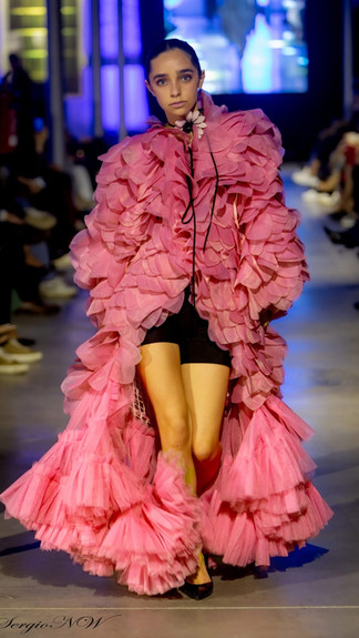 IMC MODEL: Tatiana Dinis wearing By Vel on the runway