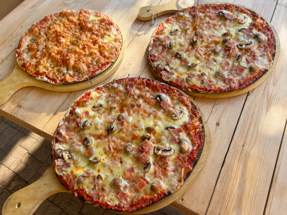 Rustic pizza trio on wooden board