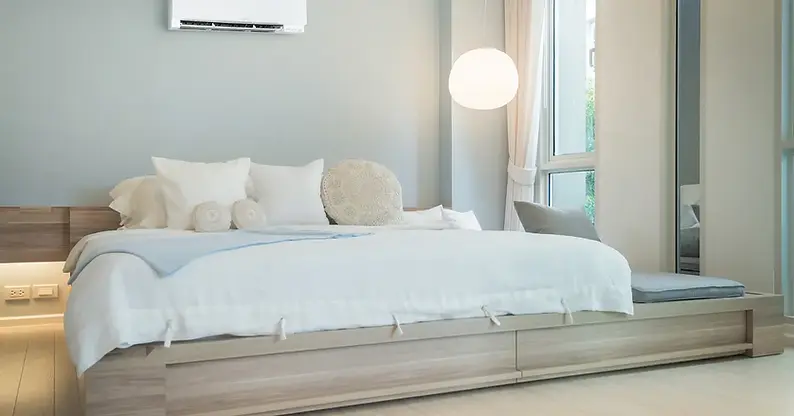 Image of a bed in a primary bedroom.