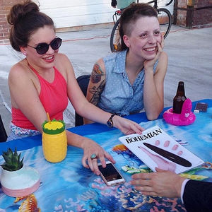 Emmy and Nico distributing Volume 2, Issue 3