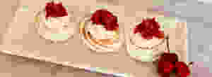 mini pavlovas with cherries and strawberries