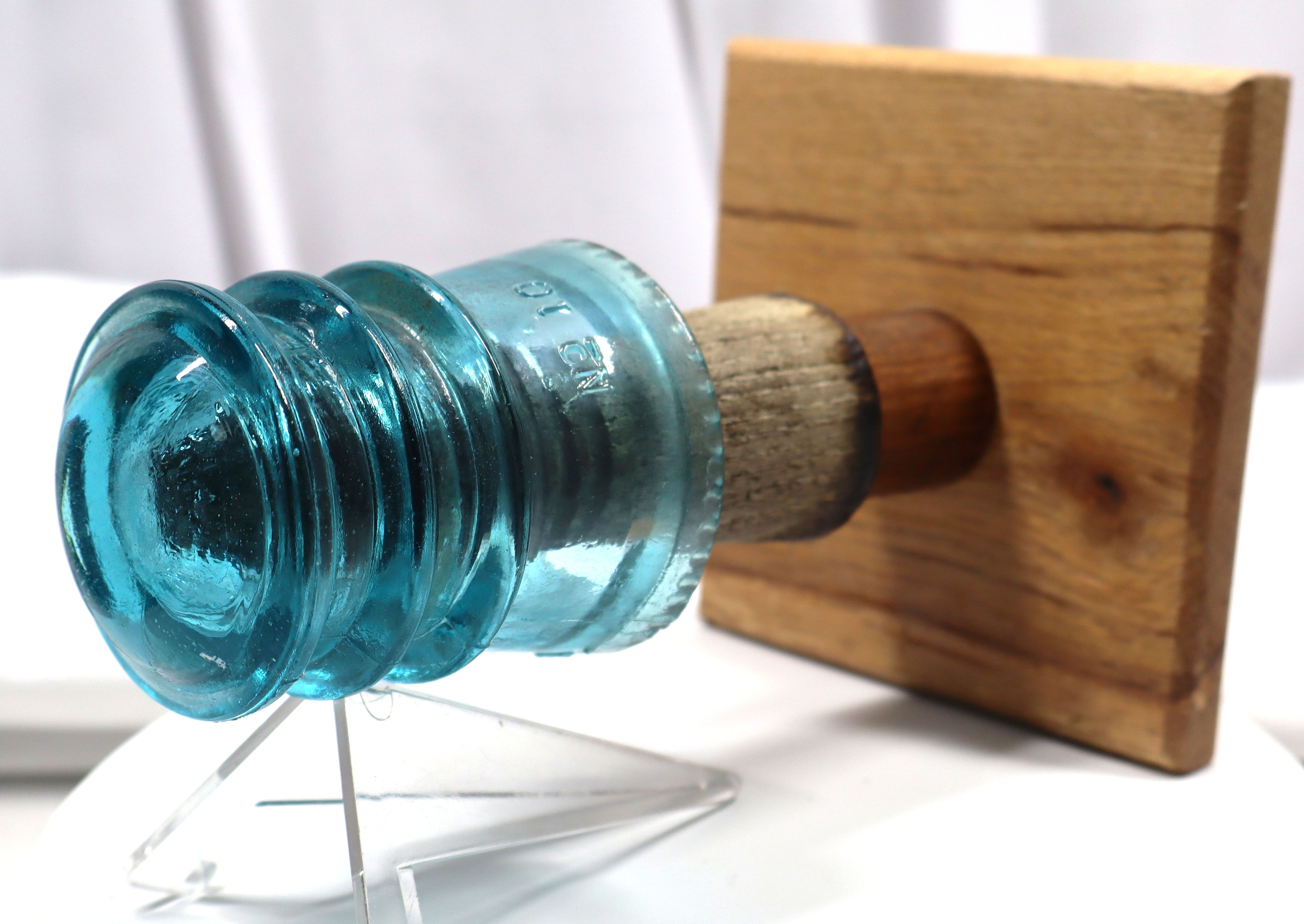 Glass Insulator Wall Hook mounted on its original threaded wood post.