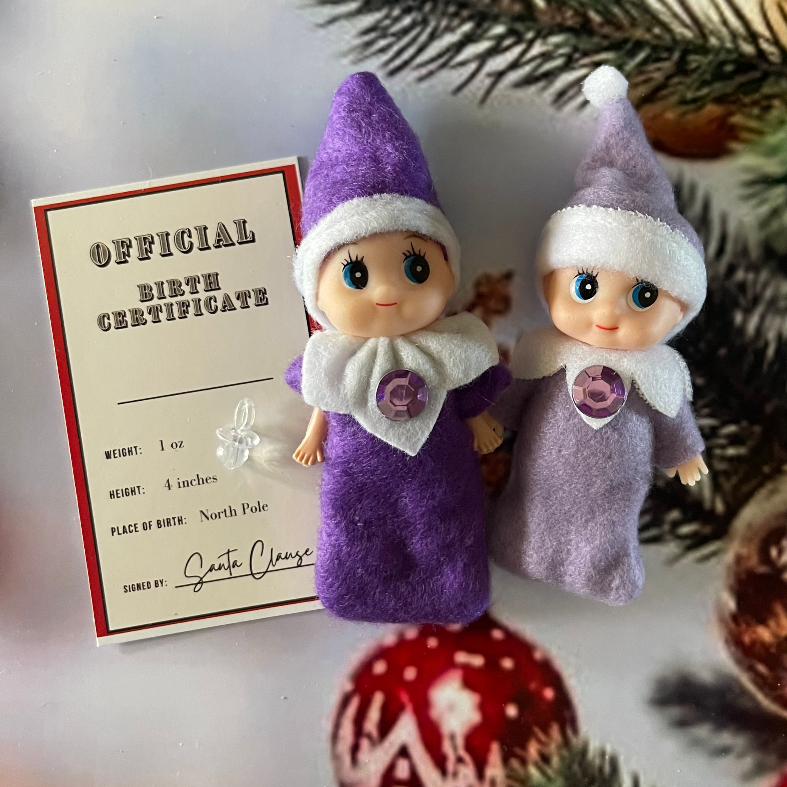 Purple baby girl elf with dummy and birth certificate 