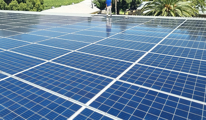 Solar Clean Cape doing maintenance and cleaning on a commercial PV installation at a wine cellar.