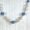 Thumbnail: Silver Swirl and Winter Blue Sparkle Globe Necklace